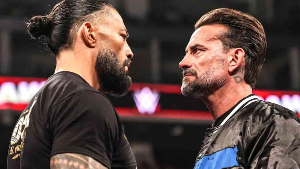 CM Punk and Roman Reigns stare down during a WWE Raw segment.