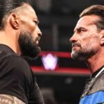 CM Punk and Roman Reigns stare down during a WWE Raw segment.