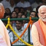 Alt Text: Prime Minister Narendra Modi and Congress president Mallikarjun Kharge at a public political event.