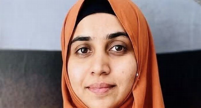 Nida Khan in a headscarf, related to the Nashik TCS case.