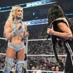 Women’s WWE Superstars standing in the ring during a SmackDown segment.