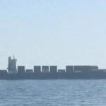 US Marines boarding Iranian cargo ship M/V Touska in Strait of Hormuz after engine disabled by gunfire.