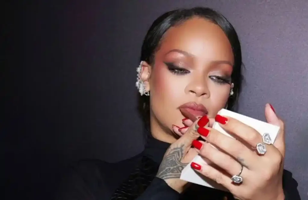 Rihanna applying Fenty Beauty makeup at the Fenty Beauty Ki Haveli pop-up event in Mumbai, April 2026.