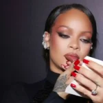 Rihanna applying Fenty Beauty makeup at the Fenty Beauty Ki Haveli pop-up event in Mumbai, April 2026.