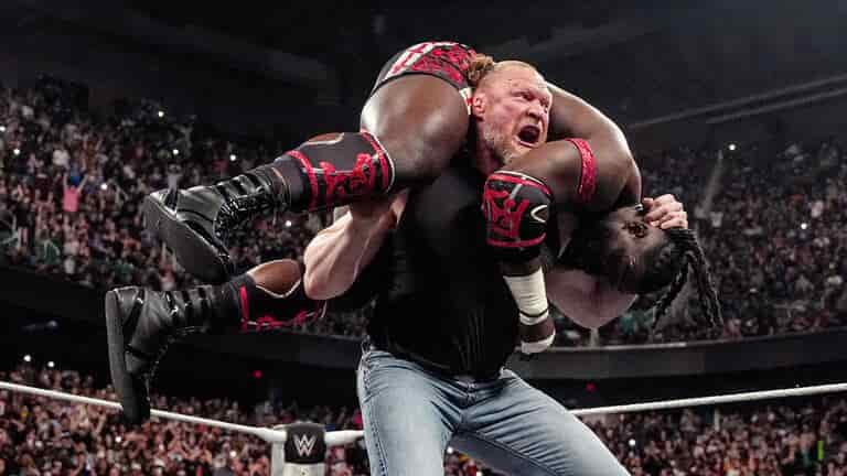Brock Lesnar lifts Oba Femi for an F-5 during WWE Raw in Greensboro.