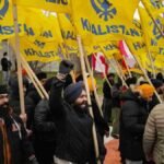 Protesters holding Khalistan flags outside a temple in Canada.