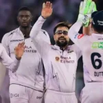 Gujarat Titans players celebrating a wicket during an IPL match.