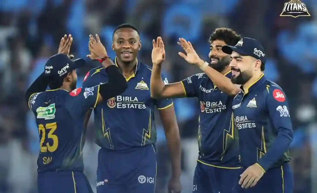 Gujarat Titans players celebrating a wicket during their IPL 2026 match.