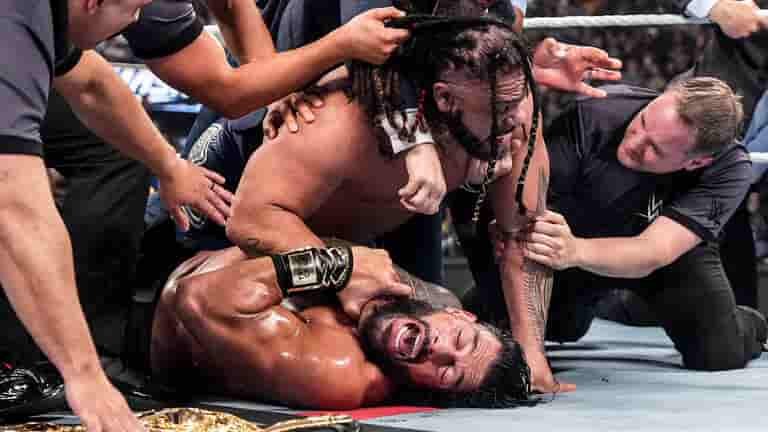 Roman Reigns retained his title by pinning Fatu after escaping a Tongan Death Grip and delivering a spear.