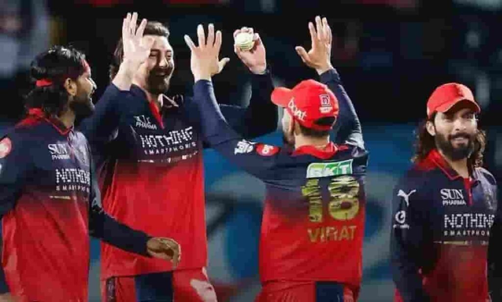 RCB players celebrating a wicket at HPCA Stadium, Dharamsala.