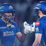 Shubman Gill and Sai Sudharsan share a fist bump during Gujarat Titans' celebration.
