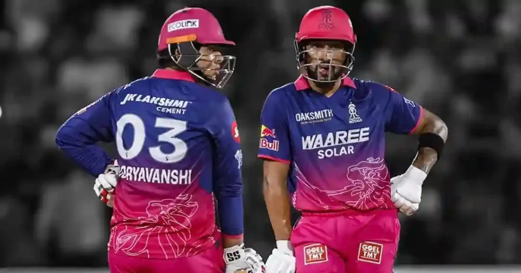 Vaibhav Sooryavanshi in Rajasthan Royals jersey walking on the field, Sawai Mansingh Stadium.