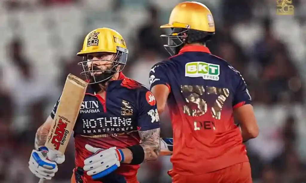Royal Challengers Bengaluru batters in yellow helmets during an IPL match.