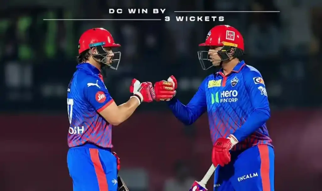 Two Delhi Capitals players fist-bumping on the cricket pitch with an overlay text reading "DC WIN BY 3 WICKETS".
