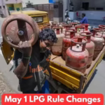 A delivery worker carrying a commercial LPG cylinder in India following the May 1, 2026, price increase.